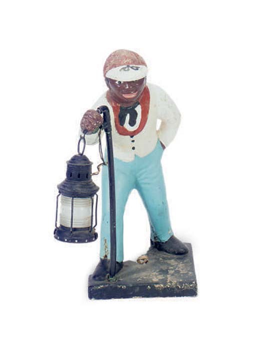 A CAST STONE FIGURE OF A JOCKEY HOLDING A LANTERN,