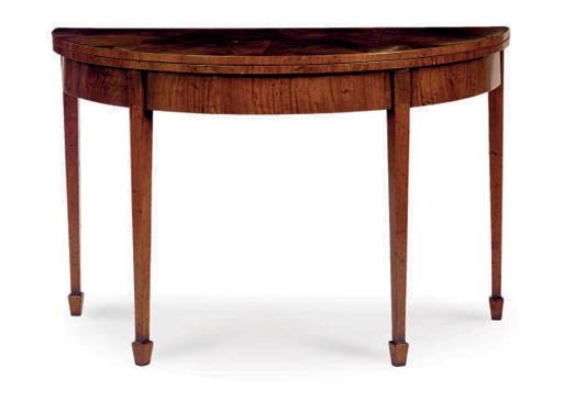 AN ENGLISH WALNUT FOLD OVER GAMES TABLE,