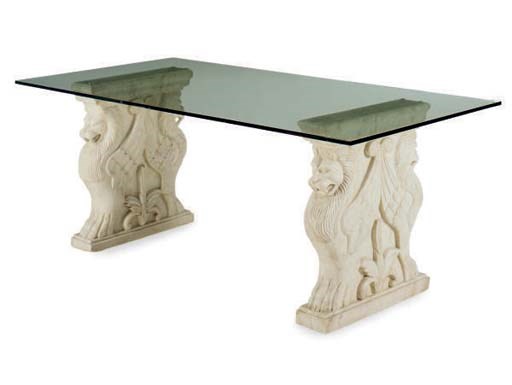 A LIMESTONE CARVED BASE AND GLASS TOP DINING TABLE,