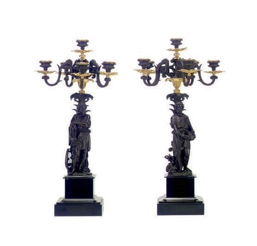 A PAIR OF GILT AND PATINATED BRONZE FIGURAL SIX-LIGHT CANDELABRA,