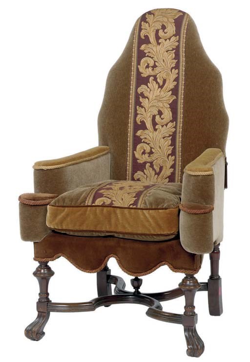 A GREEN VELVET UPHOLSTERED CARVED WALNUT ARMCHAIR,