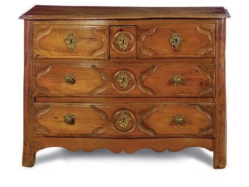 A LOUIS XV PROVINCIAL CARVED WALNUT COMMODE,