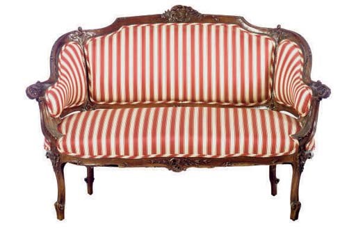 A CONTINENTAL WALNUT SETTEE,