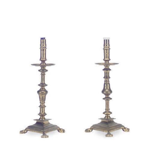 A PAIR OF BRASS PRICKET STICKS MOUNTED AS LAMPS,