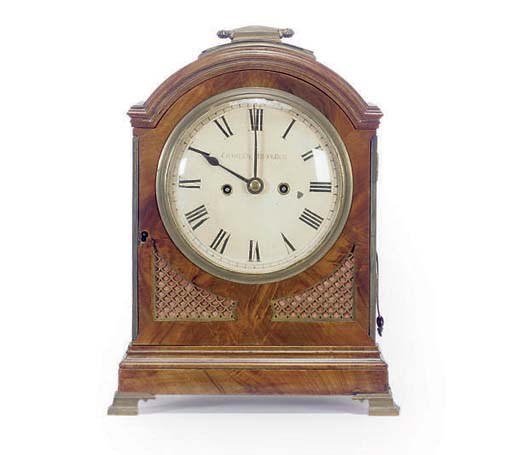 A REGENCY BRASS MOUNTED MAHOGANY MANTLE CLOCK,