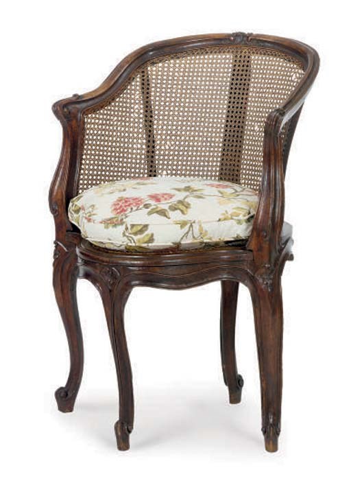 A LOUIS XV CARVED WALNUT FAUTEUIL DE BUREAU,