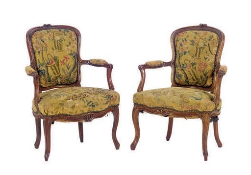 A PAIR OF LOUIS XV WALNUT FAUTUILS,