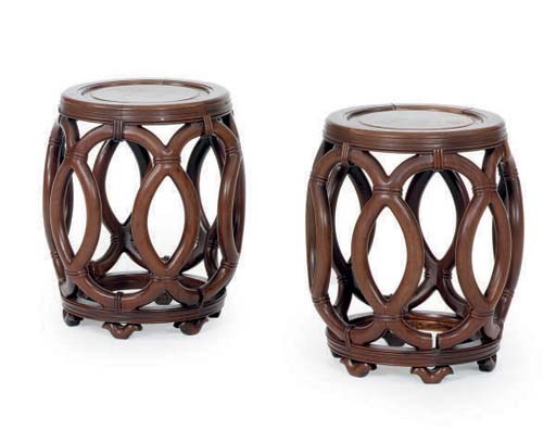 A PAIR OF CARVED HARDWOOD GARDEN SEATS,