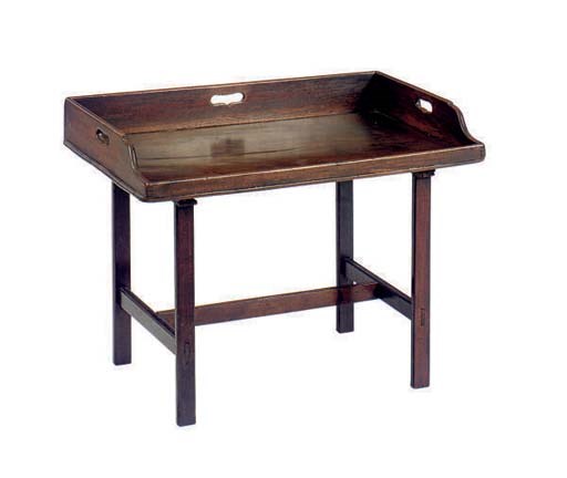 AN ENGLISH MAHOGANY TRAY ON LATER LOW STAND,