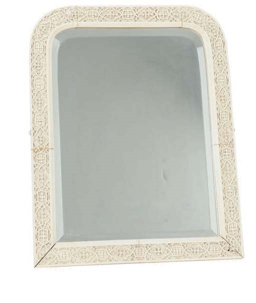 AN ANGLO-INDIAN CARVED IVORY DRESSING TABLE MIRROR**,