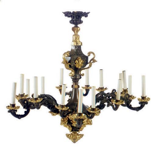 A PATINATED AND PARCEL GILT-BRONZE TWELVE LIGHT CHANDELIER,