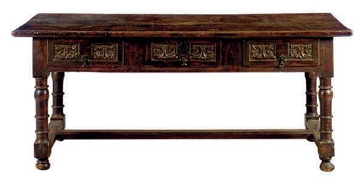 A SPANISH CARVED WALNUT TABLE,
