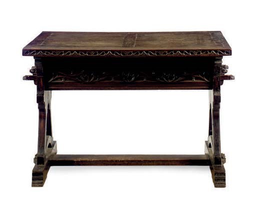 AN IBERIAN CARVED WALNUT CENTER TABLE,