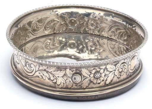 A GEORGE III SILVER WINE COASTER
