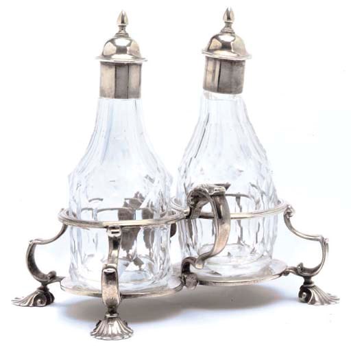 A GEORGE II IRISH SILVER OIL AND VINEGAR FRAME