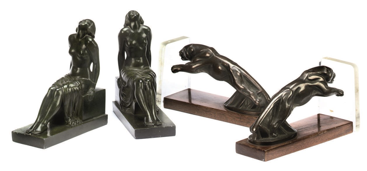 A PAIR OF BRONZE MODELS OF JAGUARS