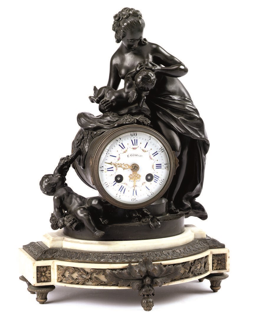 A French bronze and marble figural eight day striking mantel clock