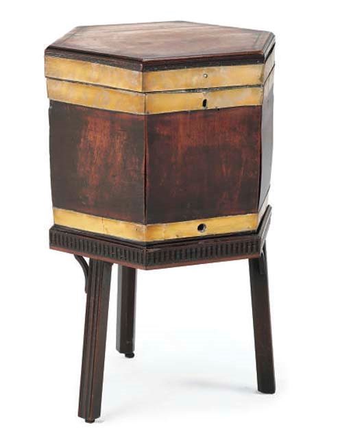 A GEORGE III MAHOGANY INLAID AND BRASS-BOUND HEXAGONAL CELLARET