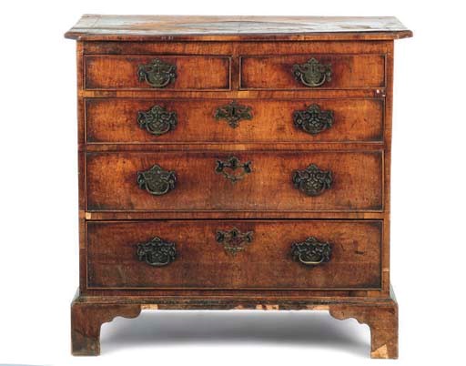 A WALNUT AND MAHOGANY CROSSBANDED CHEST