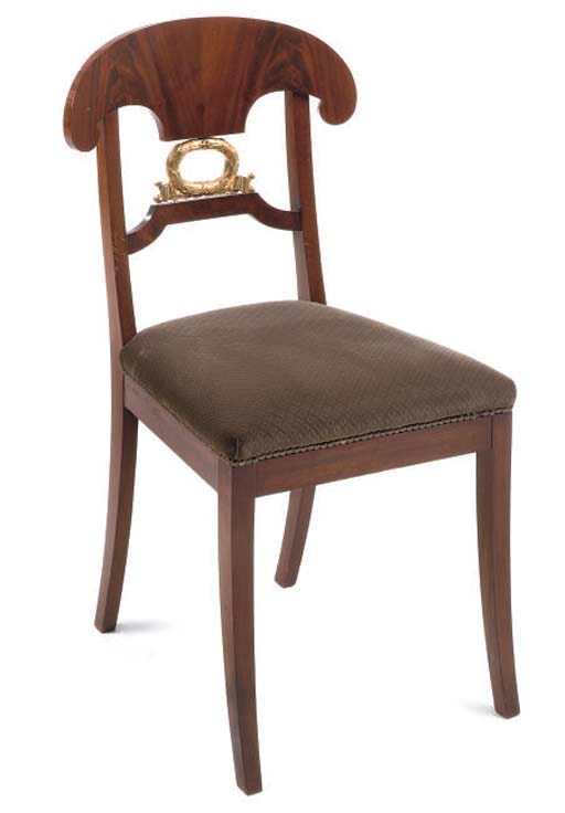A SET OF FOUR MAHOGANY AND PARCEL GILT DINING CHAIRS