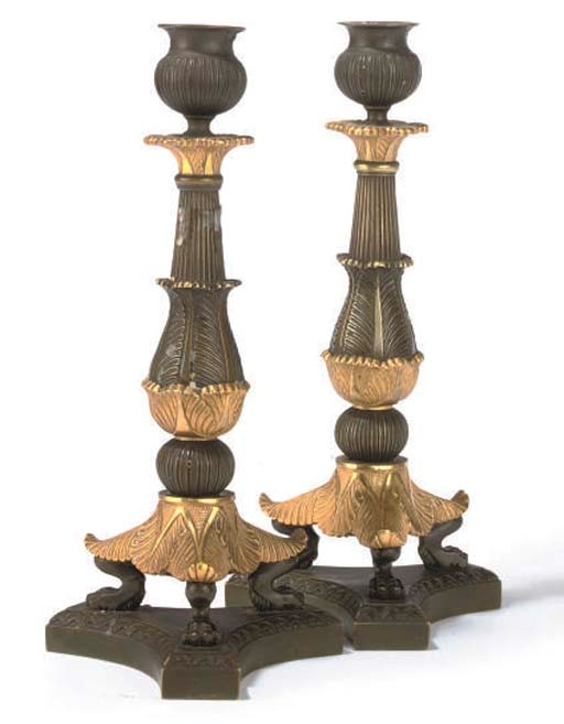A PAIR OF CHARLES X BRONZE AND ORMOLU CANDLESTICKS