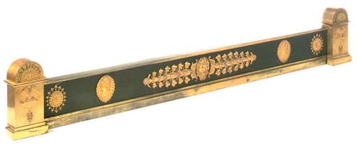 AN EMPIRE ORMOLU AND BRONZE FENDER