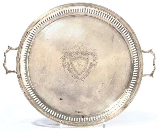 A SILVER TWO-HANDLED CIRCULAR TRAY