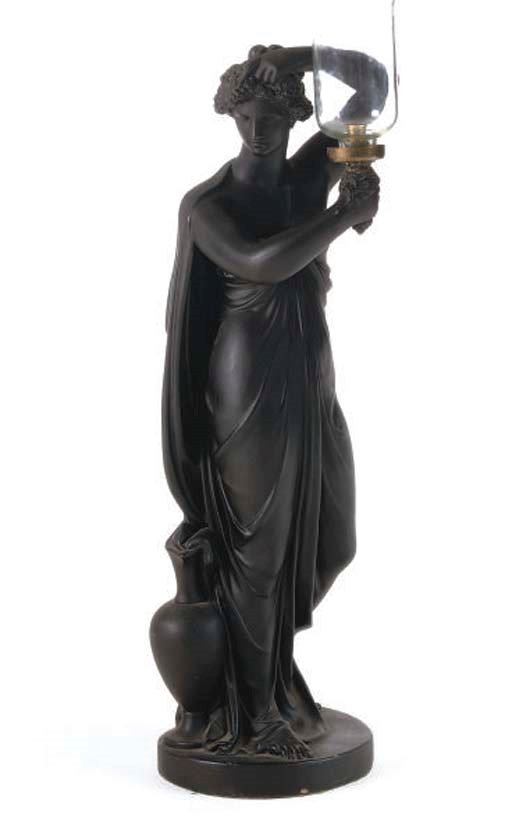 A REGENCY EBONISED PLASTER LAMP IN THE FORM OF A CLASSICAL MAIDEN