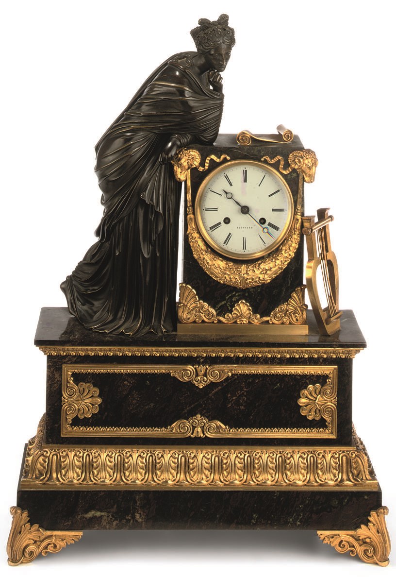 A Louis Philippe ormolu mounted marble figural mantel clock