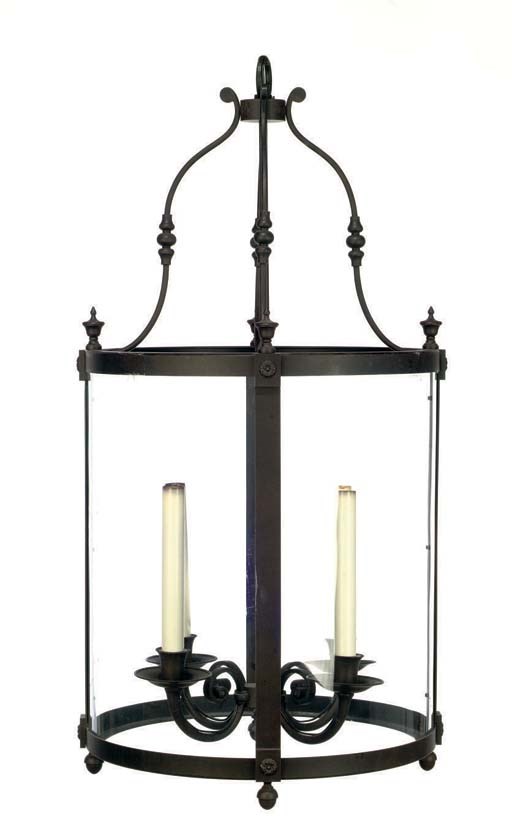 A WROUGHT-IRON AND GLASS FOUR-BRANCH CYLINDRICAL LANTERN