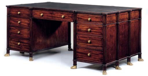 A REGENCY MAHOGANY AND EBONY-LINE DECORATED PARTNER'S PEDESTAL DESK