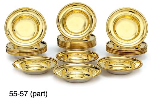 NINETEEN SILVER-GILT ASHTRAYS