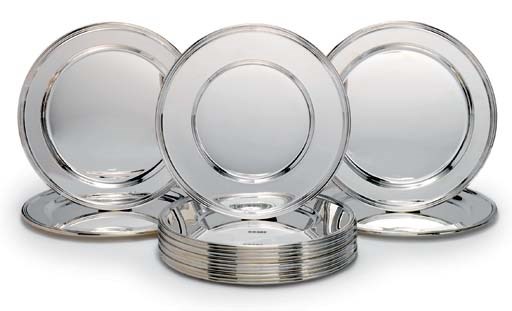 A SET OF FORTY-TWO ELIZABETH II SILVER UNDER-PLATES AND FOUR SERVING-PLATES EN SUITE