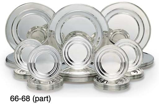 A SET OF TWENTY-FOUR ELIZABETH II SILVER UNDER-PLATES