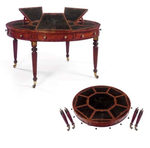 A REGENCY BRASS-MOUNTED MAHOGANY AND EBONISED CIRCULAR 'CAMPAIGN' LIBRARY TABLE