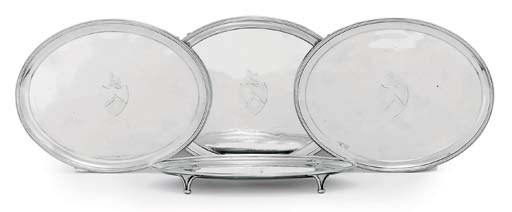 A SET OF FOUR GEORGE III SILVER WAITERS