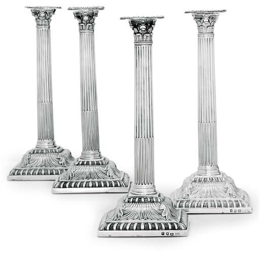 A SET OF FOUR GEORGE III SILVER CANDLESTICKS