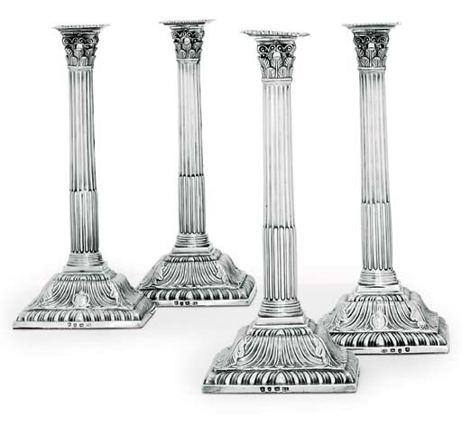 A SET OF FOUR GEORGE III SILVER CANDLESTICKS