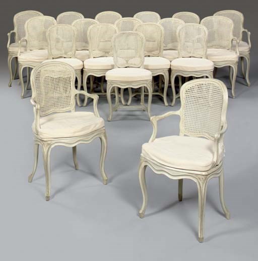 A MATCHED SET OF EIGHTEEN LOUIS XV WHITE-PAINTED CANED DINING-CHAIRS