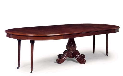 A LOUIS PHILIPPE PLUM PUDDING MAHOGANY AND MAHOGANY OVAL EXTENDING DINING-TABLE