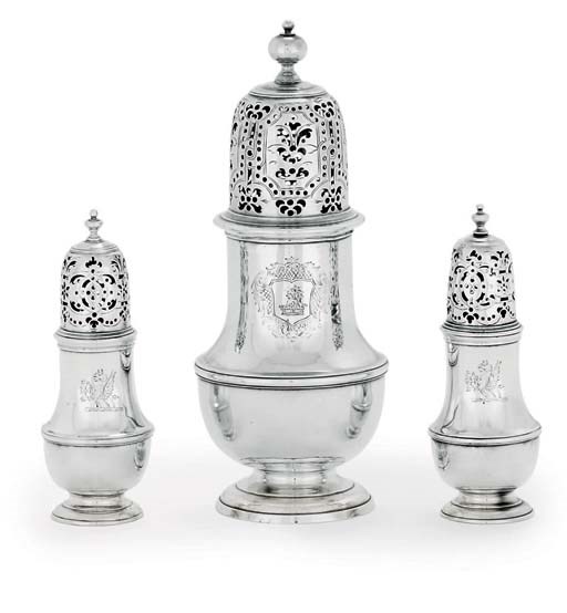 A GEORGE II SILVER CASTER AND TWO SIMILAR