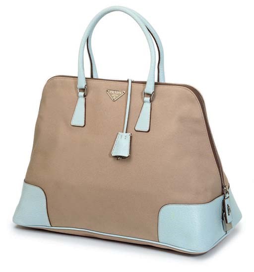 A CANVAS AND LEATHER TOTE BAG