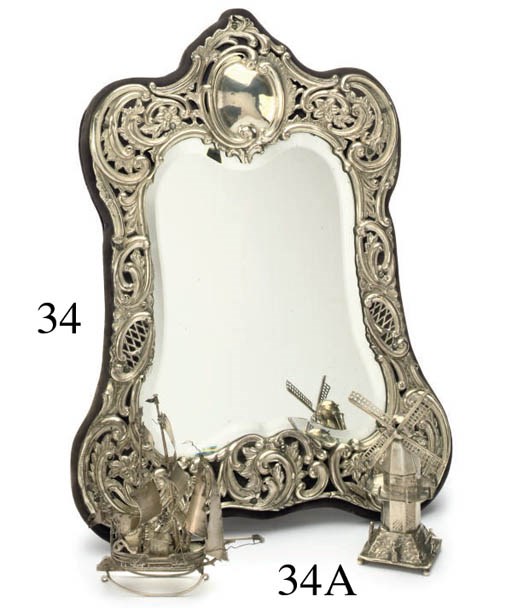 A LATE VICTORIAN SILVER MOUNTED DRESSING TABLE MIRROR