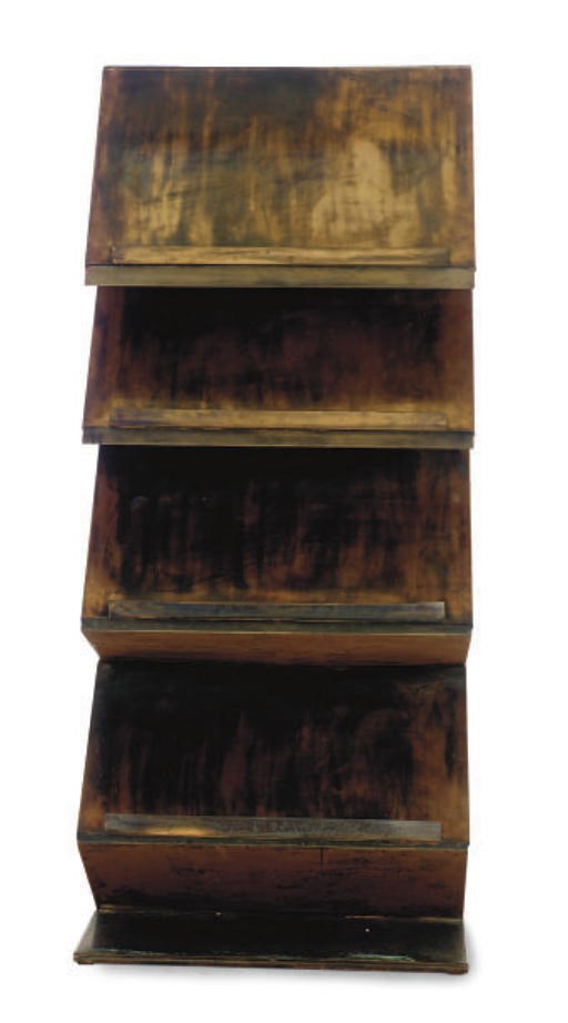 A COPPERED MAGAZINE RACK,