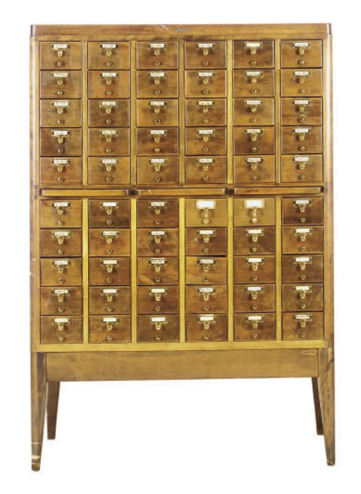 AN OAK AND BRASS CARD CATALOGUE,