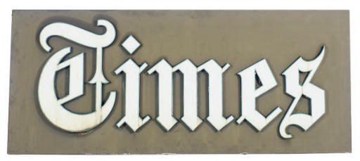 A PLASTIC AND ENAMELED METAL 'TIMES' SIGN,