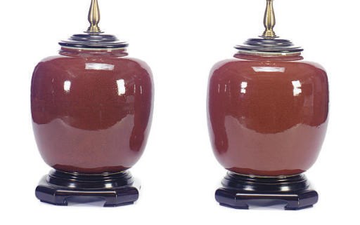 A PAIR OF CHINESE OX-BLOOD VASES MOUNTED AS TABLE LAMPS,