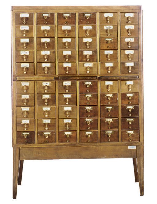AN OAK AND BRASS CARD CATALOGUE,