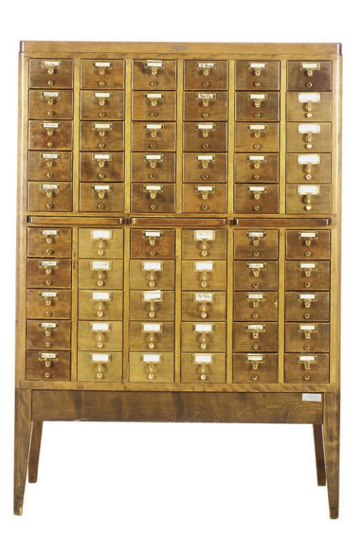 AN OAK AND BRASS CARD CATALOGUE,
