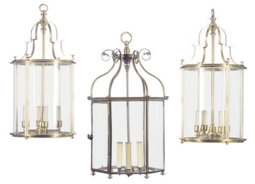 A PAIR OF ENGLISH BRASS AND GLASS CIRCULAR HALL LANTERNS TOGETHER WITH AN OCTAGONAL BRASS AND GLASS HALL LANTERN,